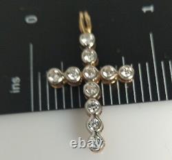 9 carat yellow gold double sided cross in two colours with stones set on both si